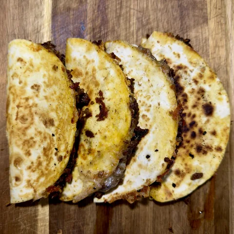 Golden-crisp sausage tacos with melted cheese